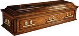 Quality solid oak casket (Huthwaite), panel sides and panel ends with full double raised lid and corner pillars in a medium oak tint